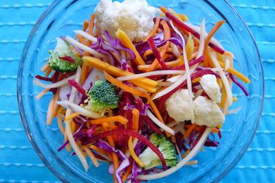 glass bowl of colourful veggie salad