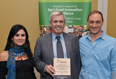 woman and two men, award for agri food excellence