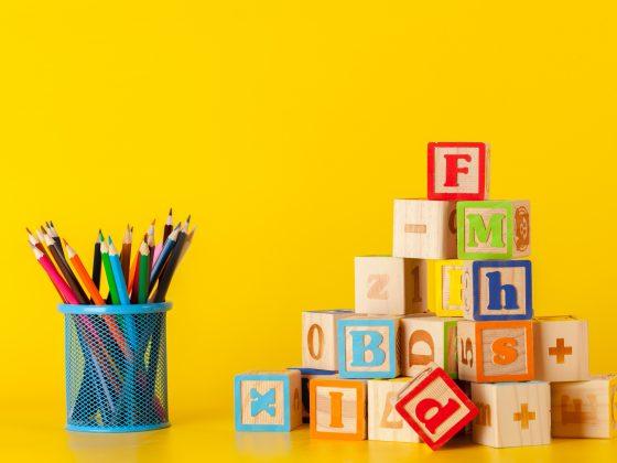 Colorful wooden blocks and cup with colorful pencils