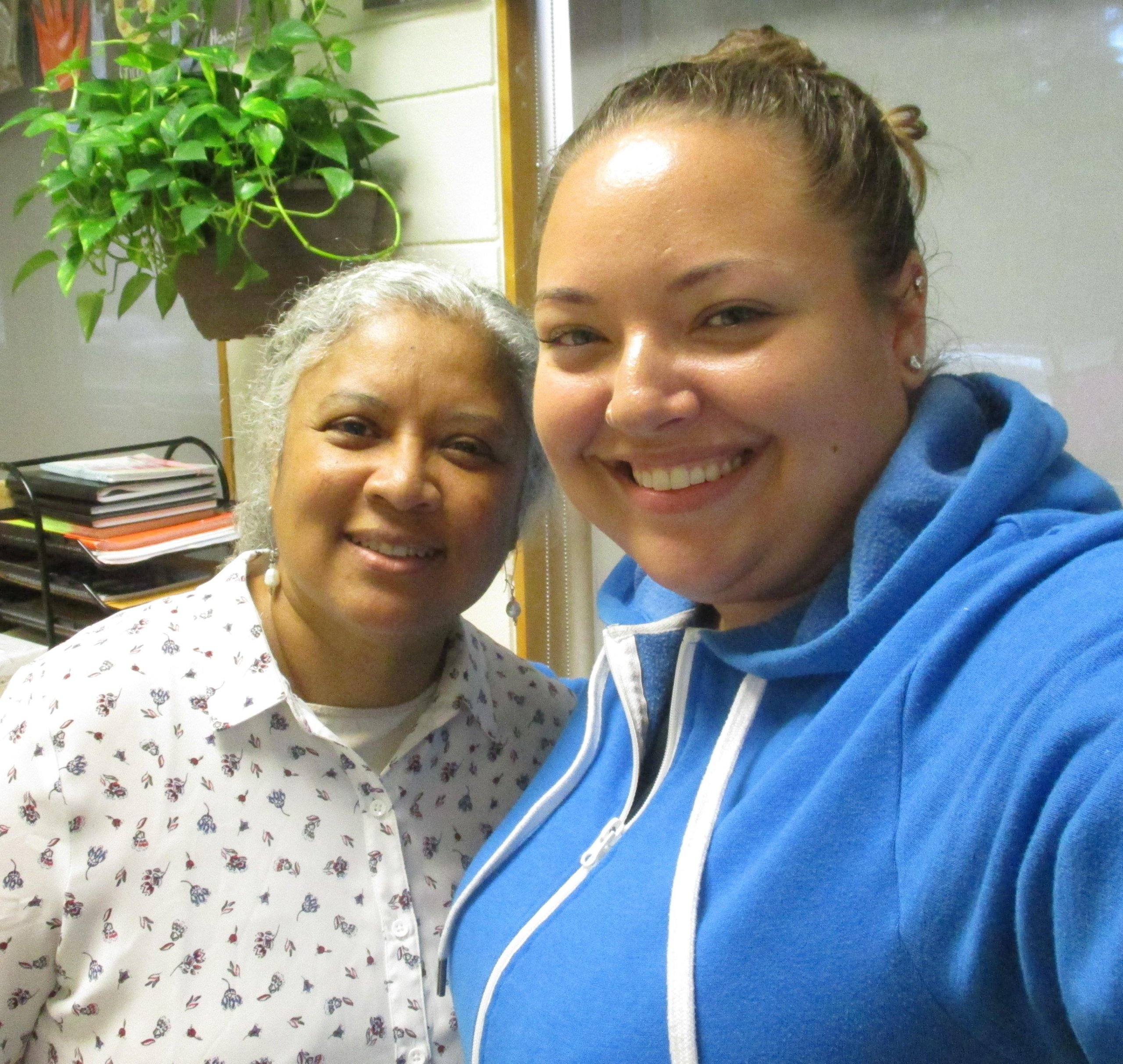 2 women smiling in office