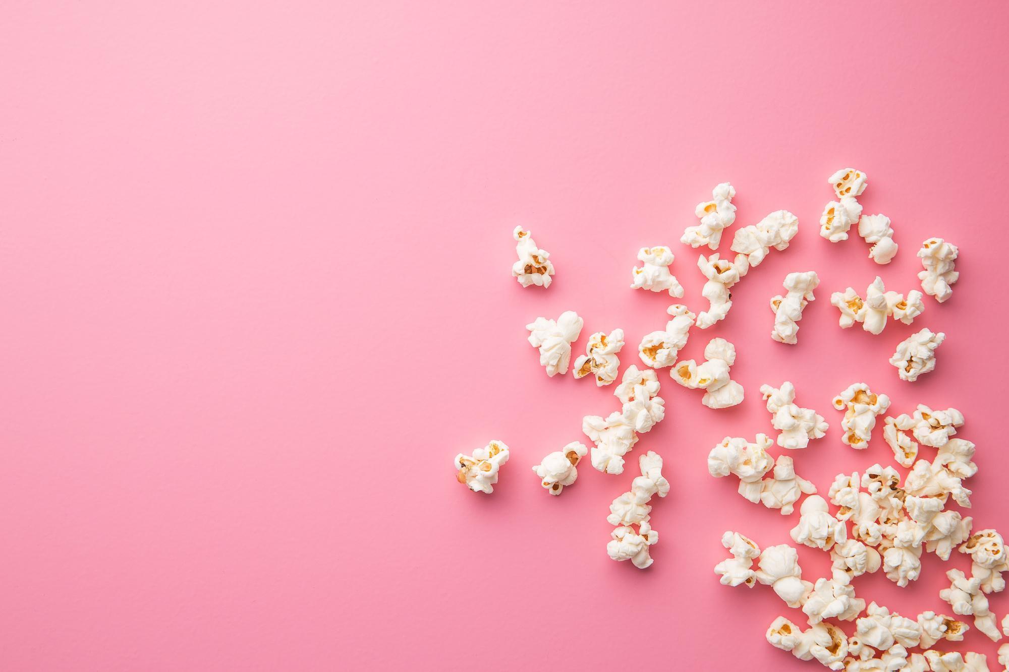 The popcorn on pink background.