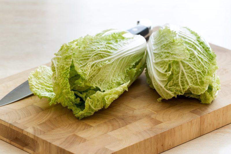 napa cabbage on wooden cutting board