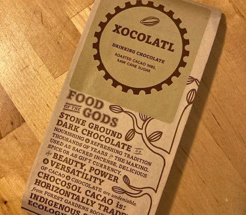 packaged chocolate bar on wood background