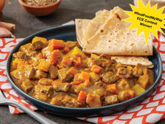 ontario beef with chunks of potato and carrots in trini curry sauce with roti