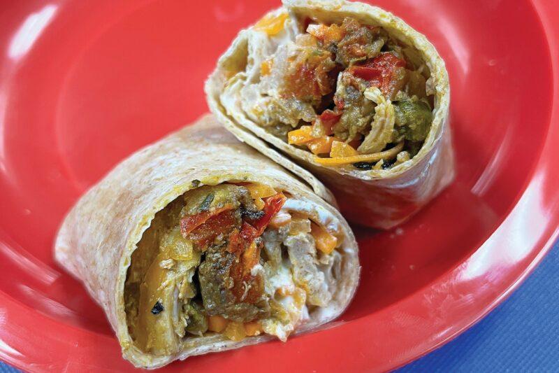 red plate with chicken fajita wrap from RFRK
