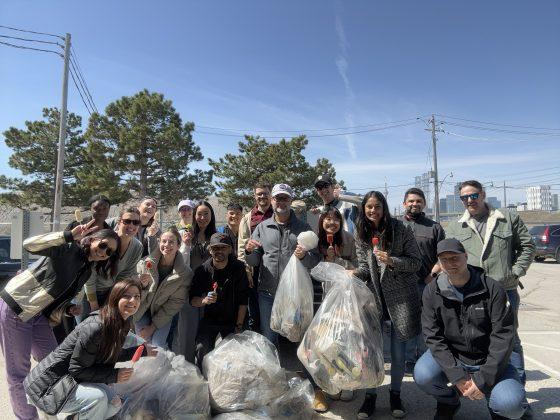 staff members gather for earth day clean up and pose for a photo