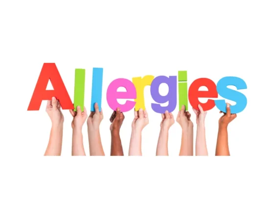 Kids holding up allergy sign with colourful letters for allergy awareness month