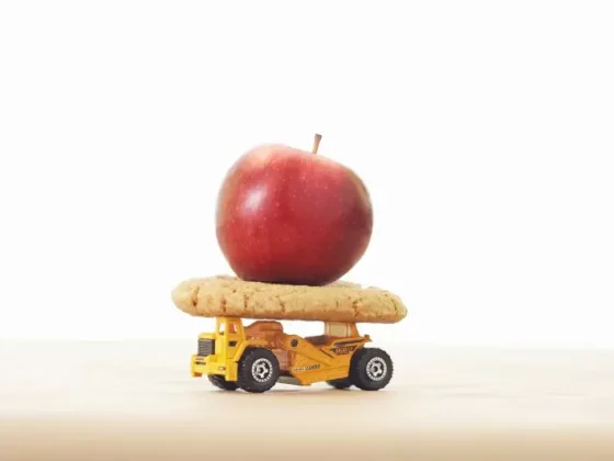 apple on cookie on toy truck