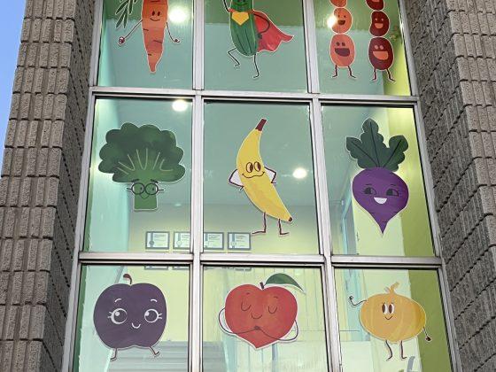 real food for real kids facility window display featuring colourful fruit and veggie characters