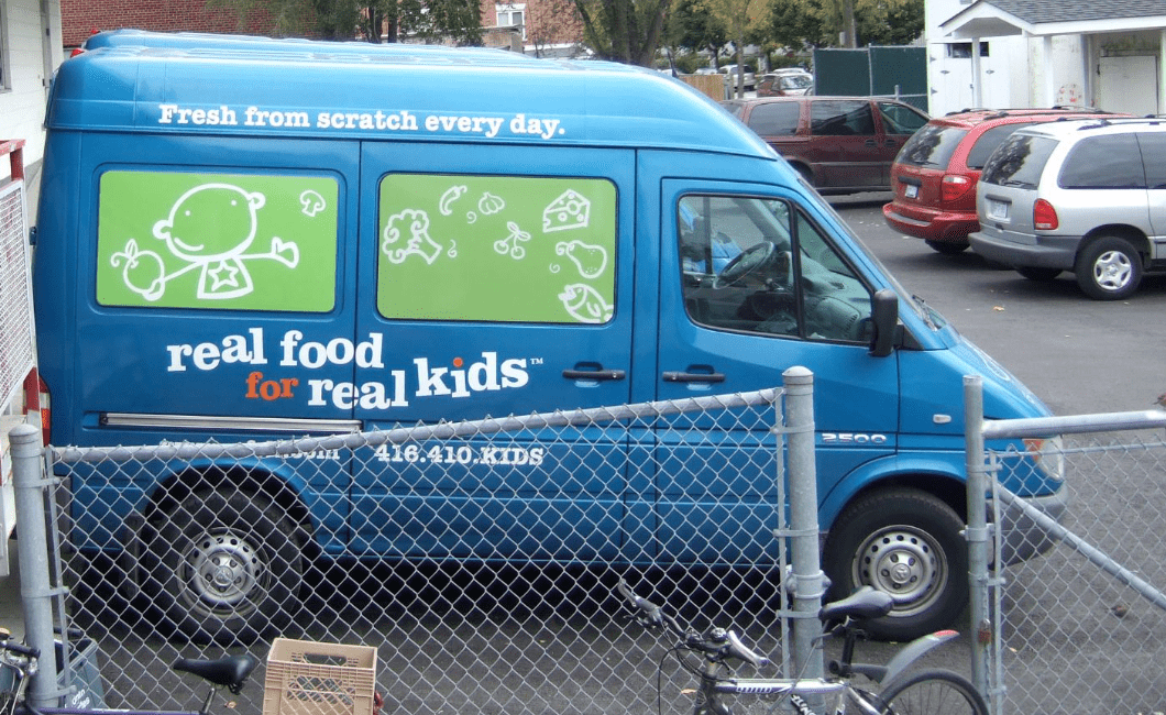 First RFRK blue and green delivery van for child care catering in Toronto