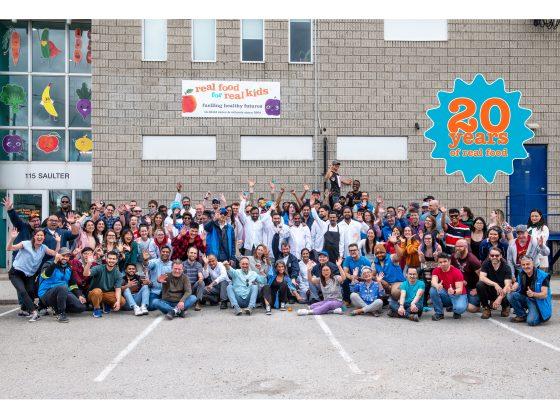 group photo of entire RFRK team in front of RFRK facility