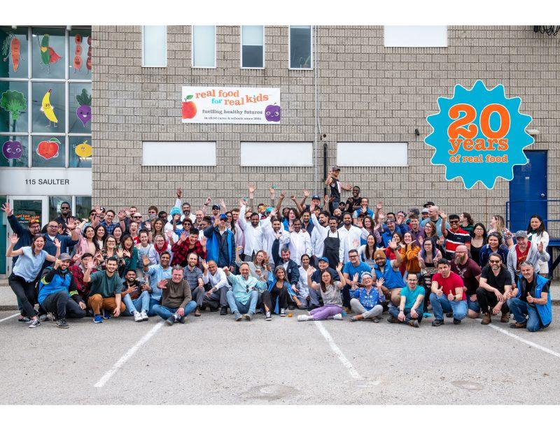 group photo of entire RFRK team in front of RFRK facility