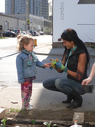 Woman gifting something to young girl