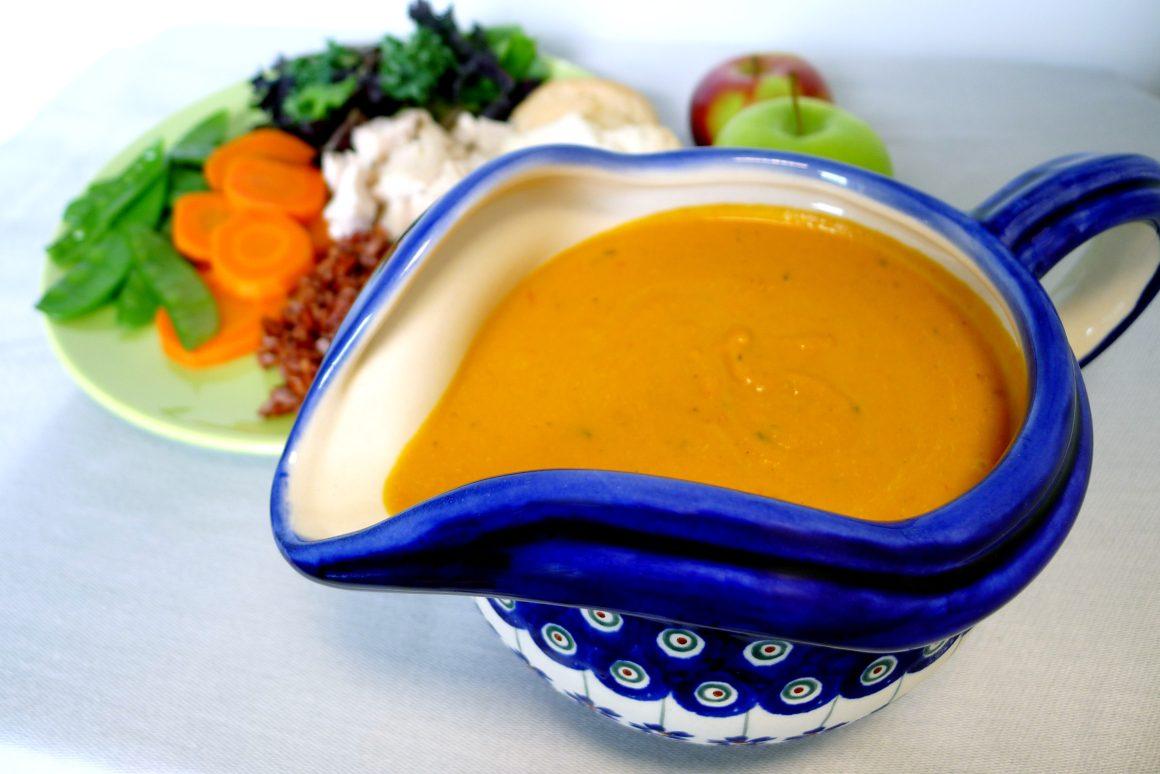 gravy boat with RFRK's homemade groovy gravy and plate of veggies in background