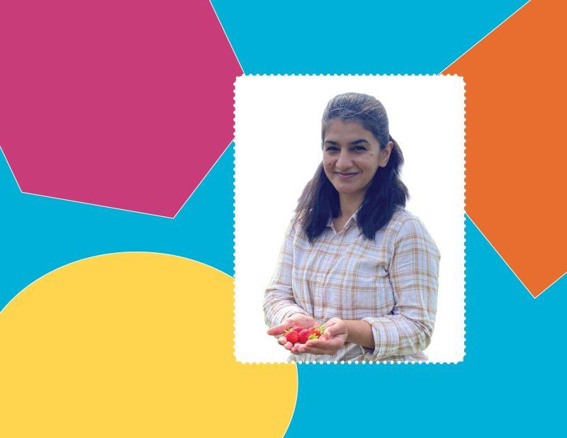 a background of various colourful shapes with a frame featuring a woman in a checkered shirt posing with strawberries in her hands