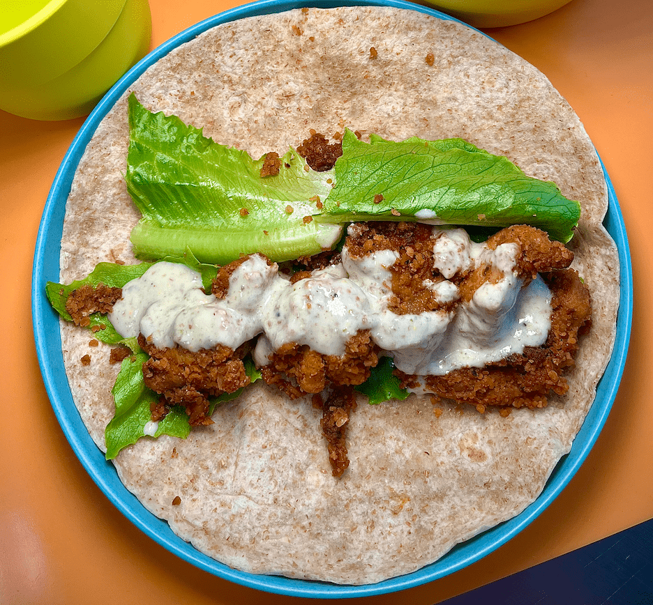 kids lunch: chickpea crusted chicken meteorite wrap with tofu caesar dressing and ontario grown hydroponic lettuce