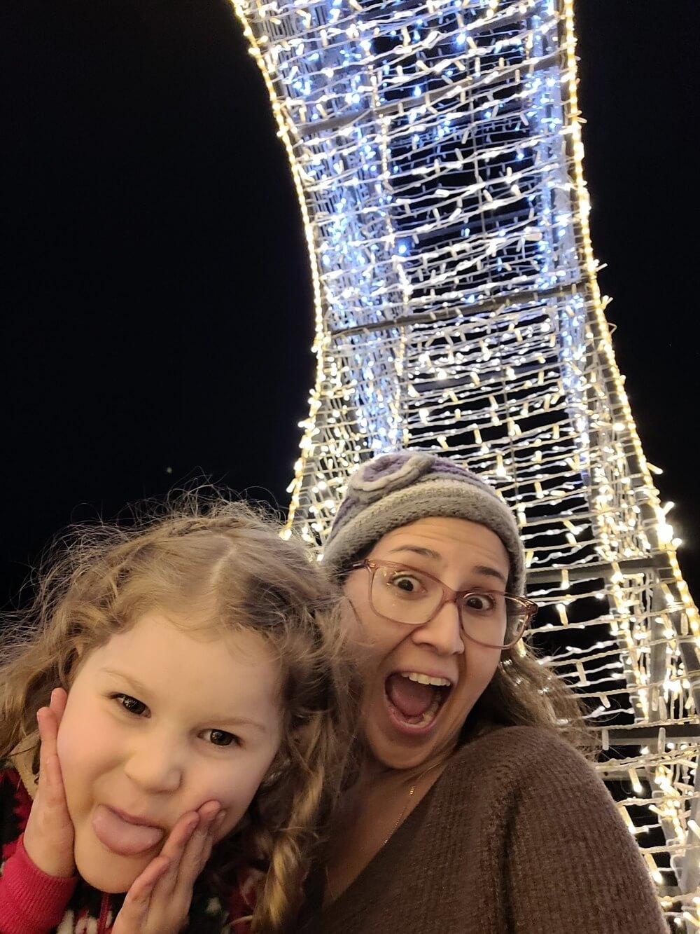 woman and daughter selfie making funny faces having fun