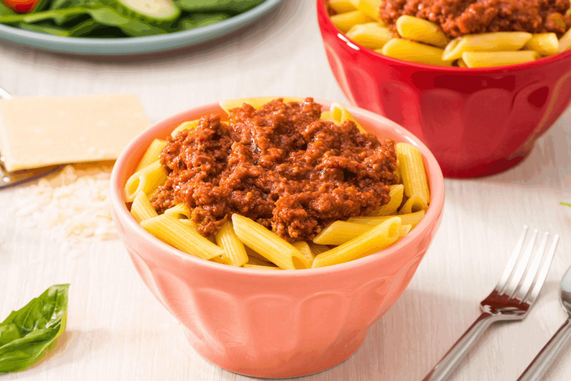 rfrk's beef bolognese recipe on top of penne in light red bowl