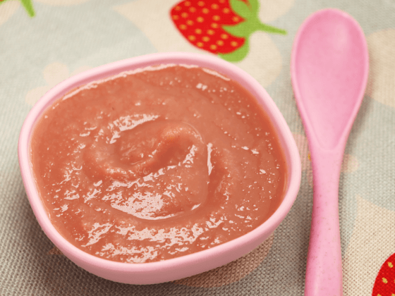 strawberry rhubarb sauce banner next to pink spoon sauce in a small pink bowl