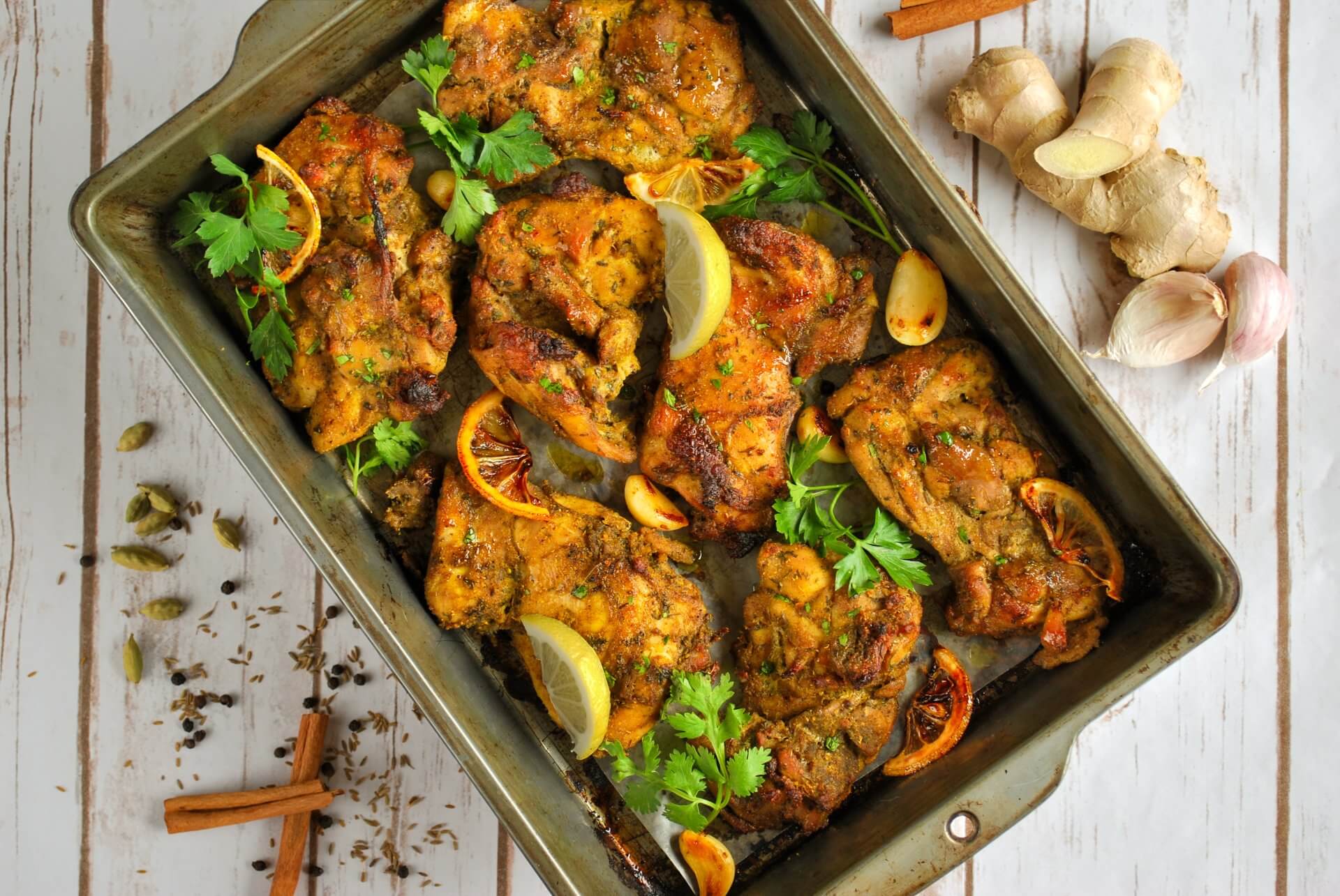 professional photography of rfrk's madagascar chicken recipe in sheet pan fresh out of the oven