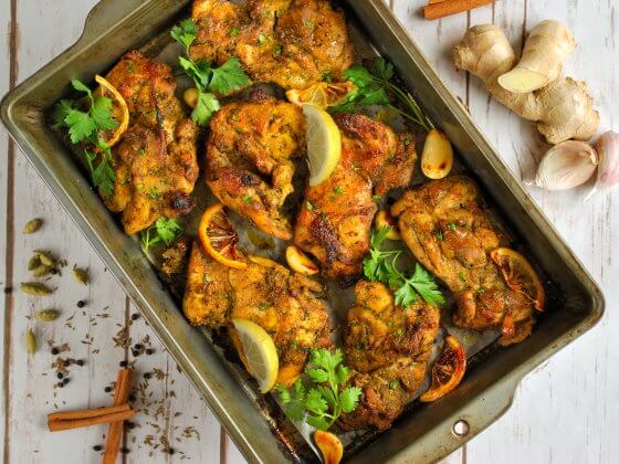 professional photography of rfrk's madagascar chicken recipe in sheet pan fresh out of the oven