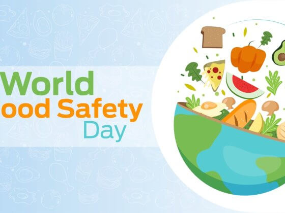 world food safety day banner depicting artwork of "world food safety day" next to bowl with globe pattern filled with food